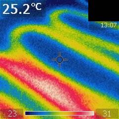 Image of heating loops, taken with a thermal image camera, showing the irregular spacing between loops