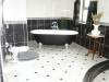 Split-level feature in bathroom, accommodating UFH on both levels