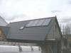 Solar panel array providing heat source for UFH, suplemented by a boiler