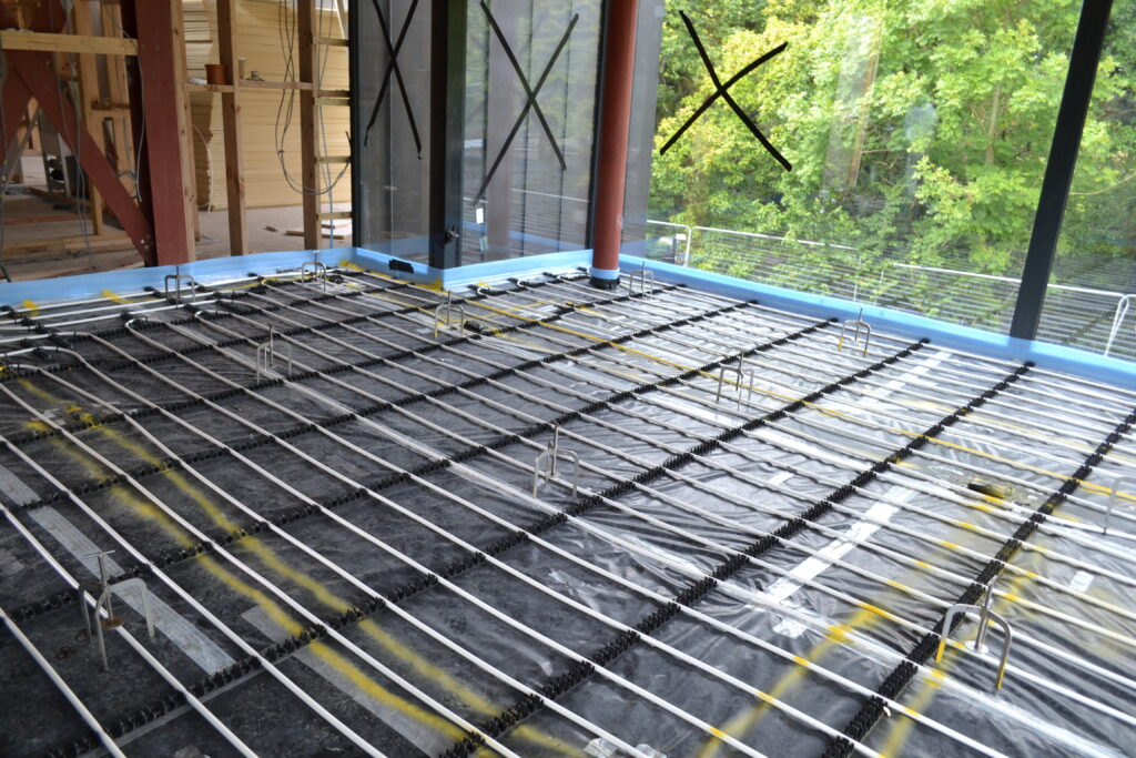 Flooring grade insulation, with the installation of underfloor heating pipe loops